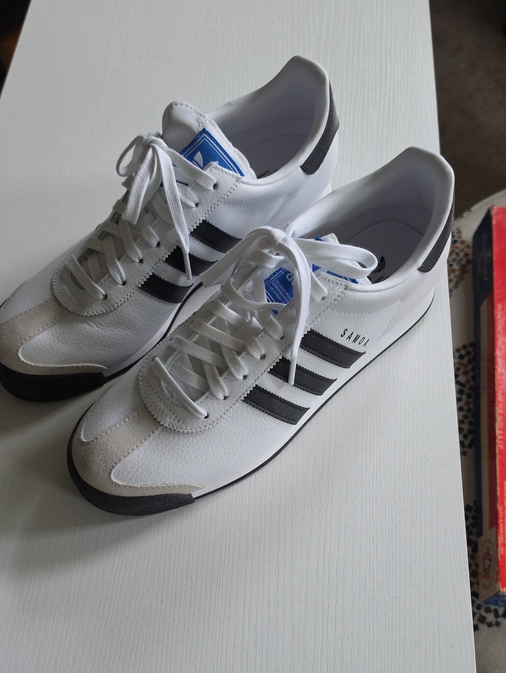 adidas White Sneakers with Black Stripes and Blue Tongue Accent